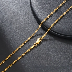 Close-up of gold stainless steel Singapore water wave chain with lobster clasp on leather