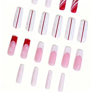Christmas coffin press-on nails set featuring red French tips and snowflake glitter designs
