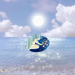 Artistic mermaid acetate hair claw clip featuring dreamy blue and white starlight patterns