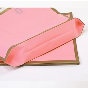 Frosted pink plastic shopping bags with gold edges for luxury boutiques and gift stores