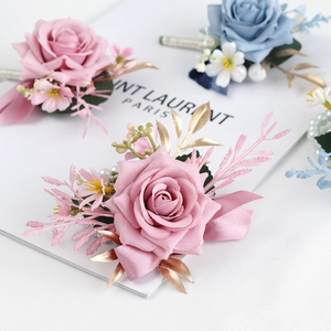 Elegant dusty pink and blue rose boutonniere set for weddings with pearls and ribbons
