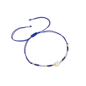 Blue beaded woven bracelet with a white star charm and adjustable sliding knot