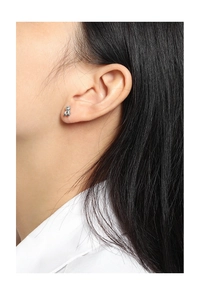 Close-up of minimalist silver bear stud earrings in S925 sterling silver on model ear