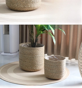 Detail of woven straw plant baskets with waterproof lining for Nordic home decor