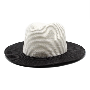 Close-up of tight weave textures and two-tone stitching on a Panama straw hat