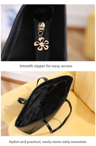 Detail of smooth metal zipper and spacious interior of the black tote shoulder bag
