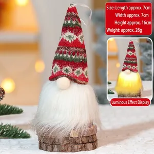 Detail of LED Christmas gnome with red knitted hat and wood base, 16cm height dimensions