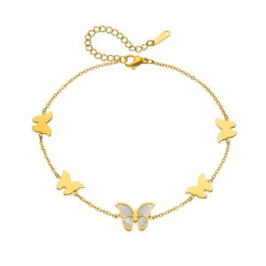 Elegant gold butterfly bracelet with white shell inlay and lobster clasp on white background