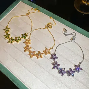 Sparkling zircon flower bracelets in green, champagne, and purple with adjustable chains