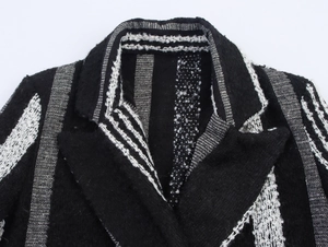 Macro detail of black and white vertical striped tweed coat collar with fringe trim
