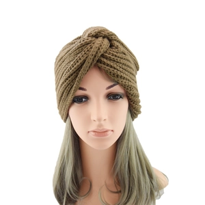 Detail of the olive brown twisted turban knot and ribbed texture on the knit beanie
