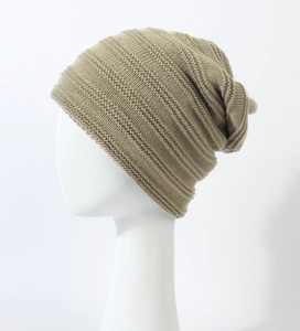 Detail of khaki slouchy knit beanie with horizontal texture on a white display head