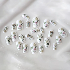 Pastel floral press-on nails with cute puppy prints on ivory square round nail tips
