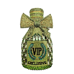 Close-up of luxury champagne bottle clutch bag with green crystals and VIP lettering