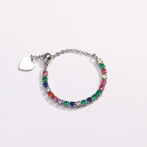 Detail of adjustable silver ring with colorful cubic zirconia stones and heart charm