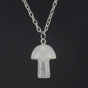 Detailed view of 2cm mini mushroom crystal pendant on a delicate silver chain