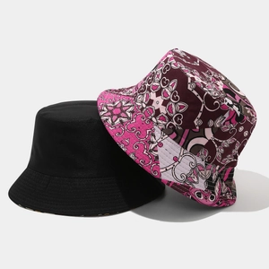 Detail of reversible bohemian floral print and solid black canvas sun bucket hat