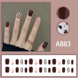 Short square press-on nails set with brown and cow pattern design, 24 piece kit