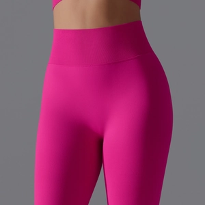 Close-up of seamless pink high-waisted yoga pants with ribbed waistband for compression