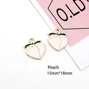 Macro view of peach enamel charms with dimensions 15mm by 18mm for DIY jewelry making