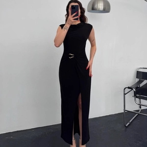 Sleeveless slim fit black maxi dress with a golden waist buckle and high side slit