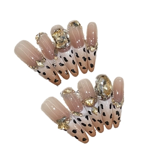 Handmade press-on nails with leopard print, nude gradient, and luxury rhinestones decoration