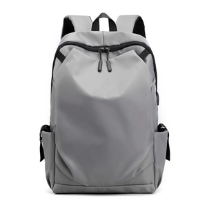 Modern grey laptop backpack for business travel with waterproof fabric and dual zippers