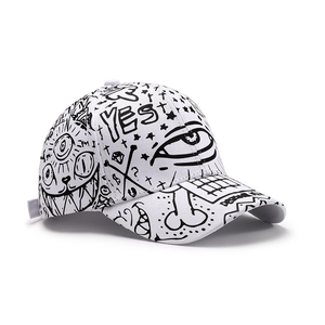 White street style baseball cap with black graffiti print and YES lettering