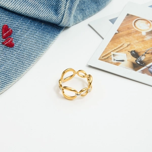 Detailed top view of gold and silver mixed color chain ring on a lifestyle background