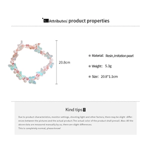 Detailed view of the resin butterfly and white imitation pearl bracelet with dimensions