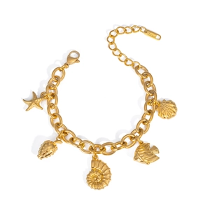 Detailed view of gold stainless steel bracelet with starfish and seashell charms