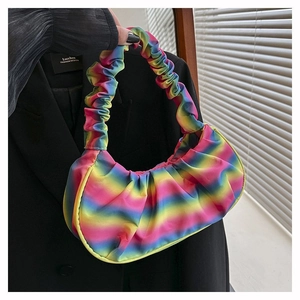 Detail of rainbow gradient pleated shoulder bag with cloud texture and satin-like finish
