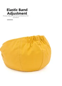 Detail view of the yellow cotton newsboy cap with elastic band for size adjustment