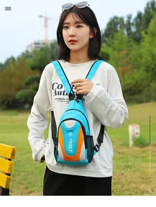 Outdoor leisure crossbody chest bag in sky blue with reflective orange detail