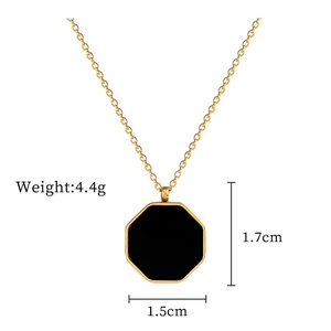 Detail of gold octagonal shell pendant with black inlay and size dimensions