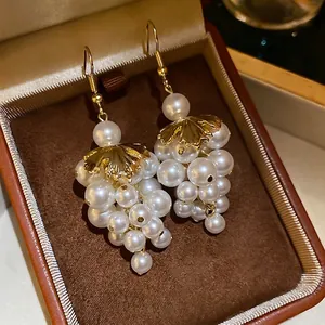 French vintage grape cluster earrings with white pearls and gold leaves in jewelry box