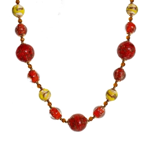 Handmade beaded necklace with red and yellow glass beads in a retro ethnic style