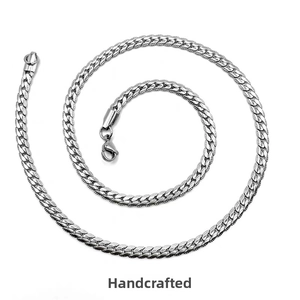 Detailed view of silver titanium steel Cuban chain with embossed texture and lobster clasp
