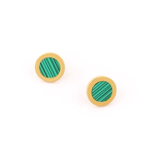 Detailed macro view of golden circular stud earrings featuring green striped resin inlay