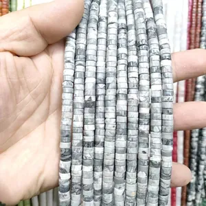 Macro detail of natural grey marble stone cylinder beads with unique marbled textures