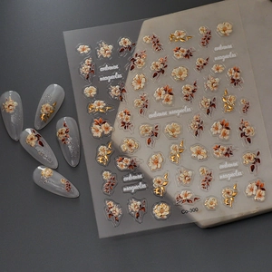 5D autumn magnolia nail stickers with gold foil floral embossing on gray manicure