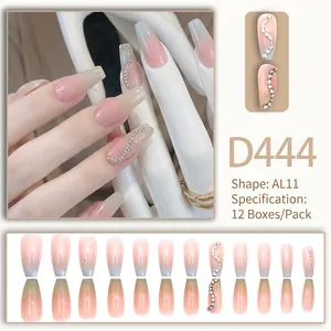Long almond gradient press-on nails in pink and blue with elegant S-shaped rhinestones