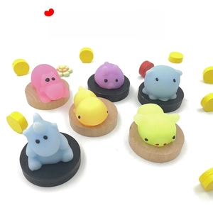 Macro shot of colorful animal mochi squishies on pedestals with TPR soft texture details