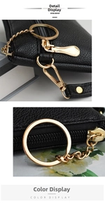 Detail of black litchi grain PU leather pouch with premium gold zipper and keychain