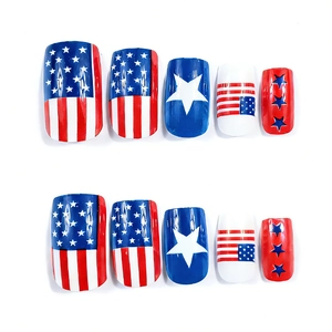 Macro view of 10-piece press-on nails featuring American flag stars and stripes design
