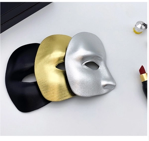 Detailed view of gold, silver, and black metallic masquerade masks for men and kids