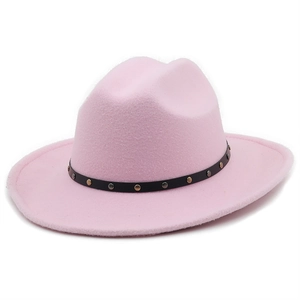 Detail of pink wool felt cowboy hat featuring a black leather band with metallic rivets