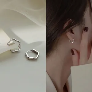 Minimalist S925 sterling silver wavy hoop earrings with elegant hollow flower design
