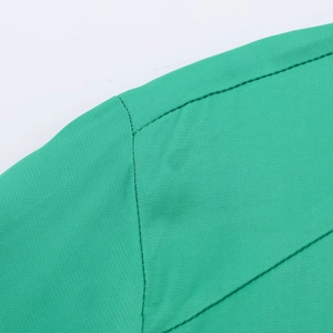 Macro detail of high-quality bright green satin fabric with precise stitching texture