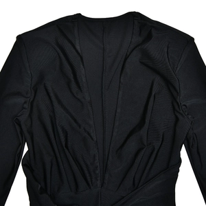 Close-up of deep V-neckline and ruched details on a slim-fit black long-sleeve bodysuit